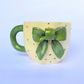 Handmade Ceramic Mug with Green Bow – Nature-Inspired Polka Dot Design